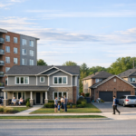 Apartment building and family homes with people gathered outside